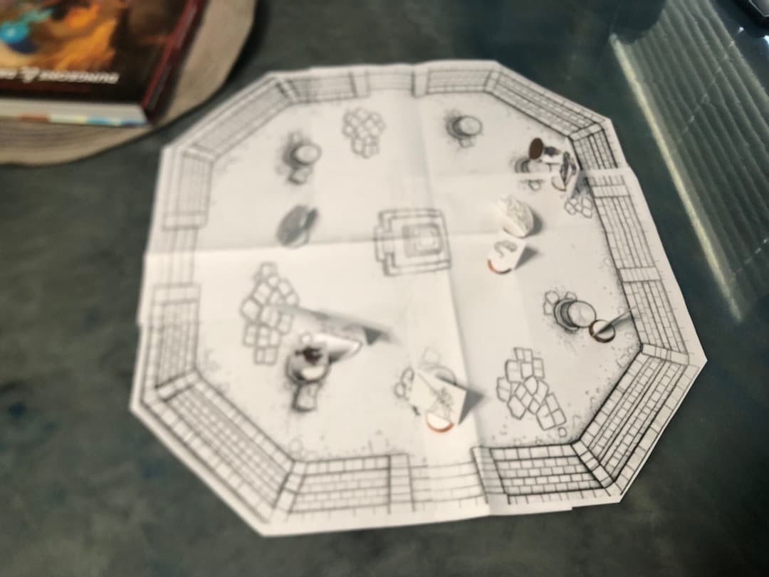 A battle map and miniatures mid-session, at the Creator's own table.